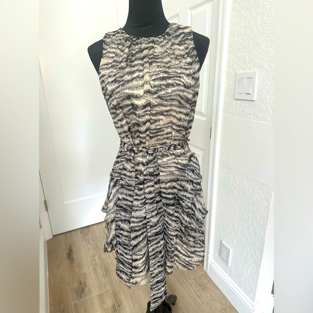 The animal print inspired black and beige dress